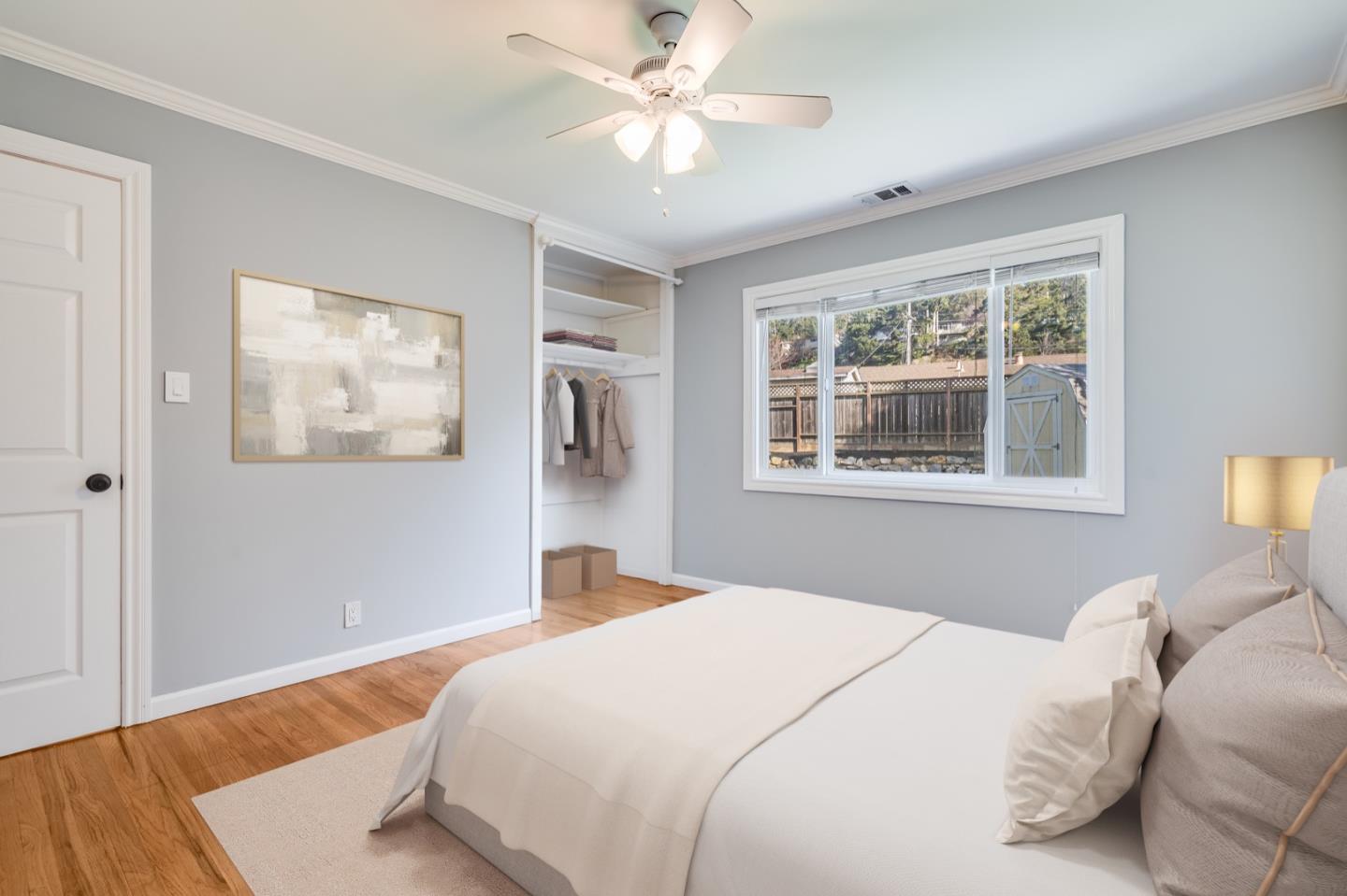 1419 Madeira Drive Pacifica, CA 94044 - Photo 13 of 66 a bedroom with a bed and a window
