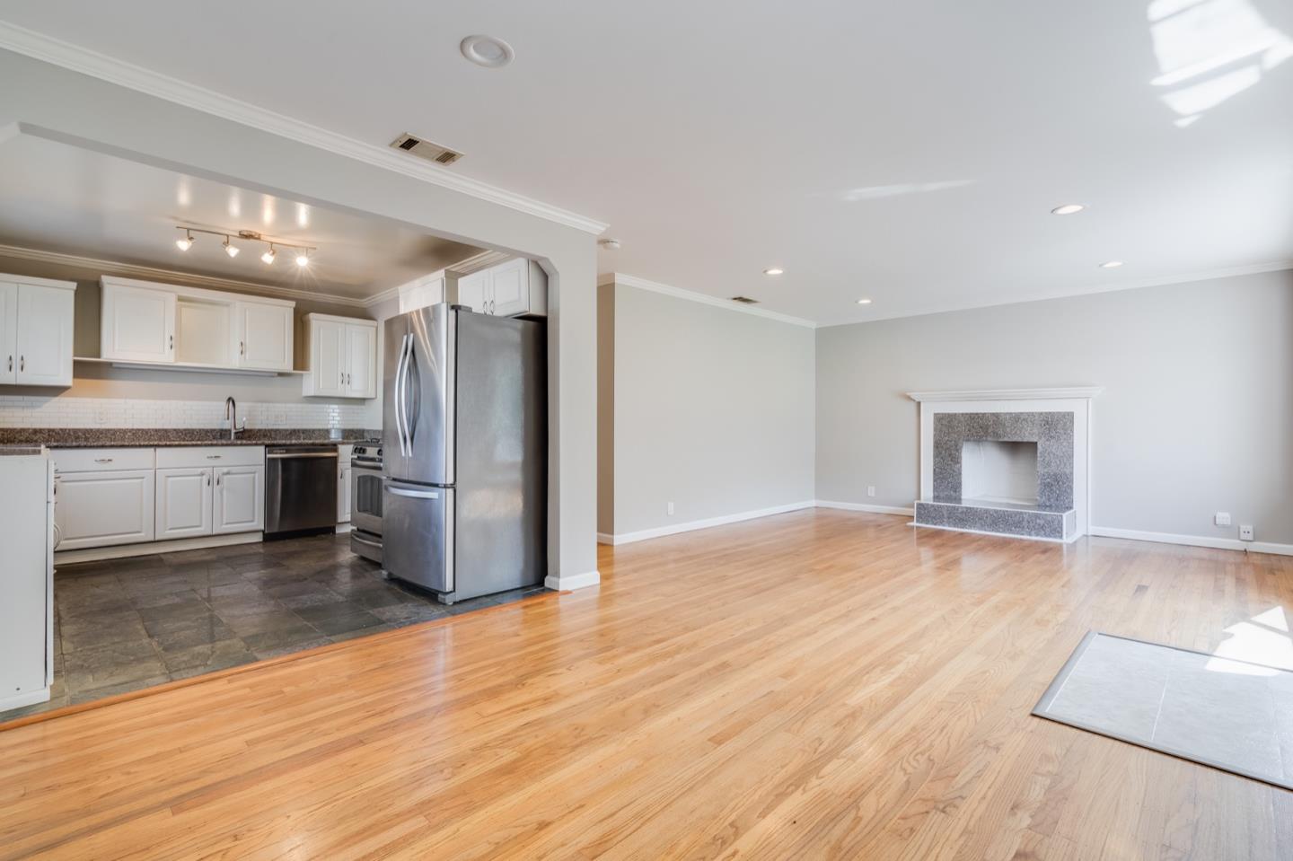 1419 Madeira Drive Pacifica, CA 94044 - Photo 16 of 66 a kitchen with stainless steel appliances granite countertop a refrigerator and a stove top oven