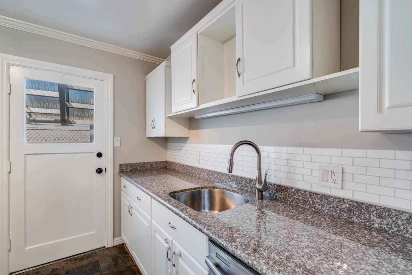 1419 Madeira Drive Pacifica, CA 94044 - Photo 24 of 66 a close view of a sink a faucet and cabinets