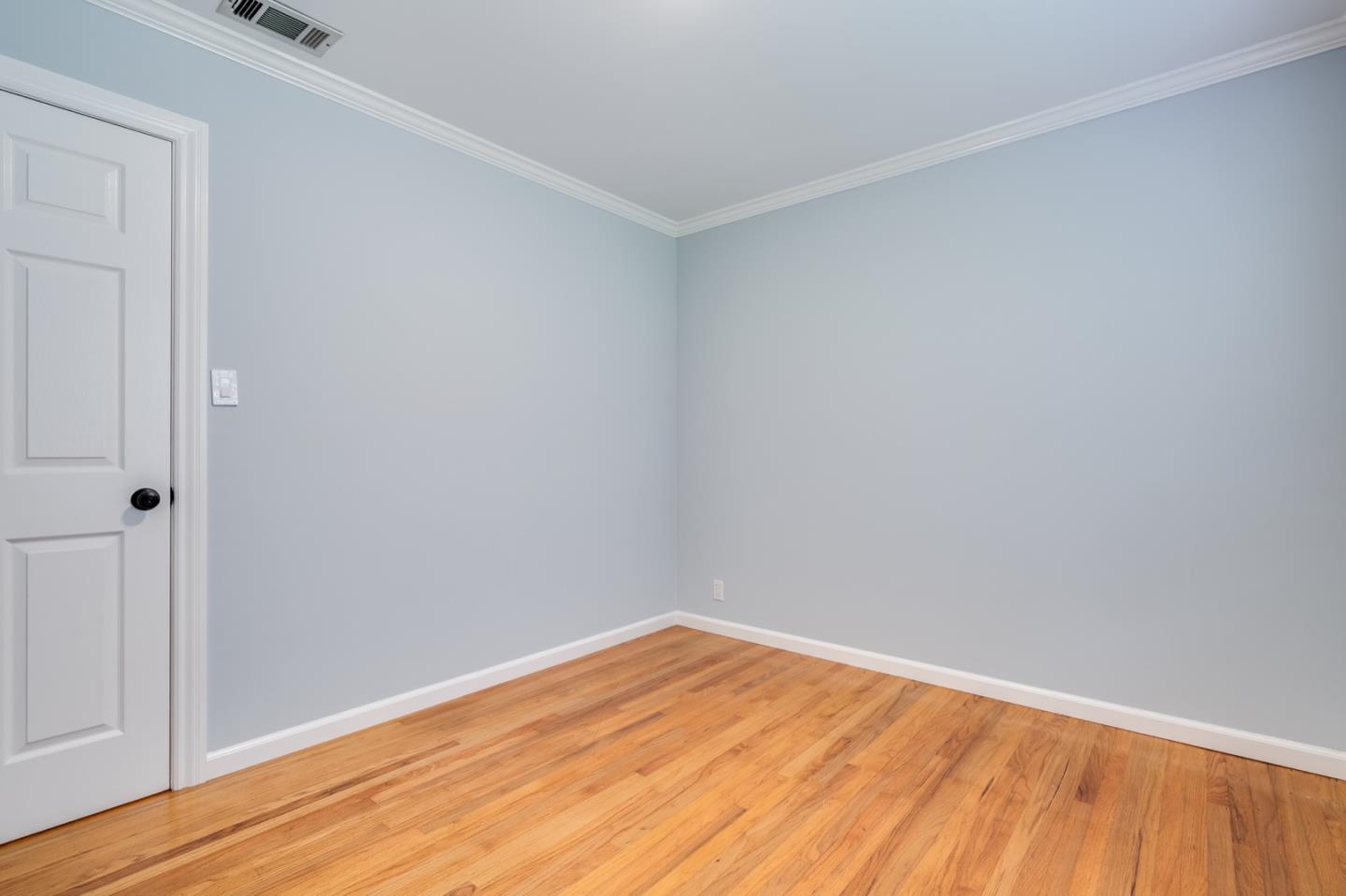 1419 Madeira Drive Pacifica, CA 94044 - Photo 38 of 66 a view of empty room with wooden floor