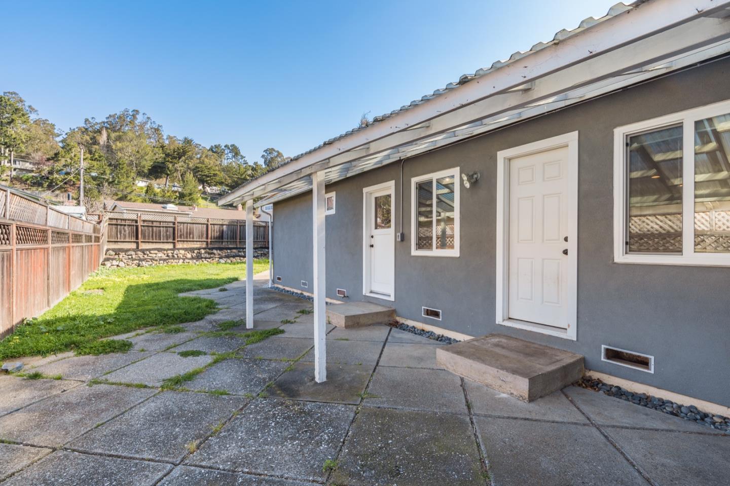 1419 Madeira Drive Pacifica, CA 94044 - Photo 41 of 66 a view of a house with backyard and porch