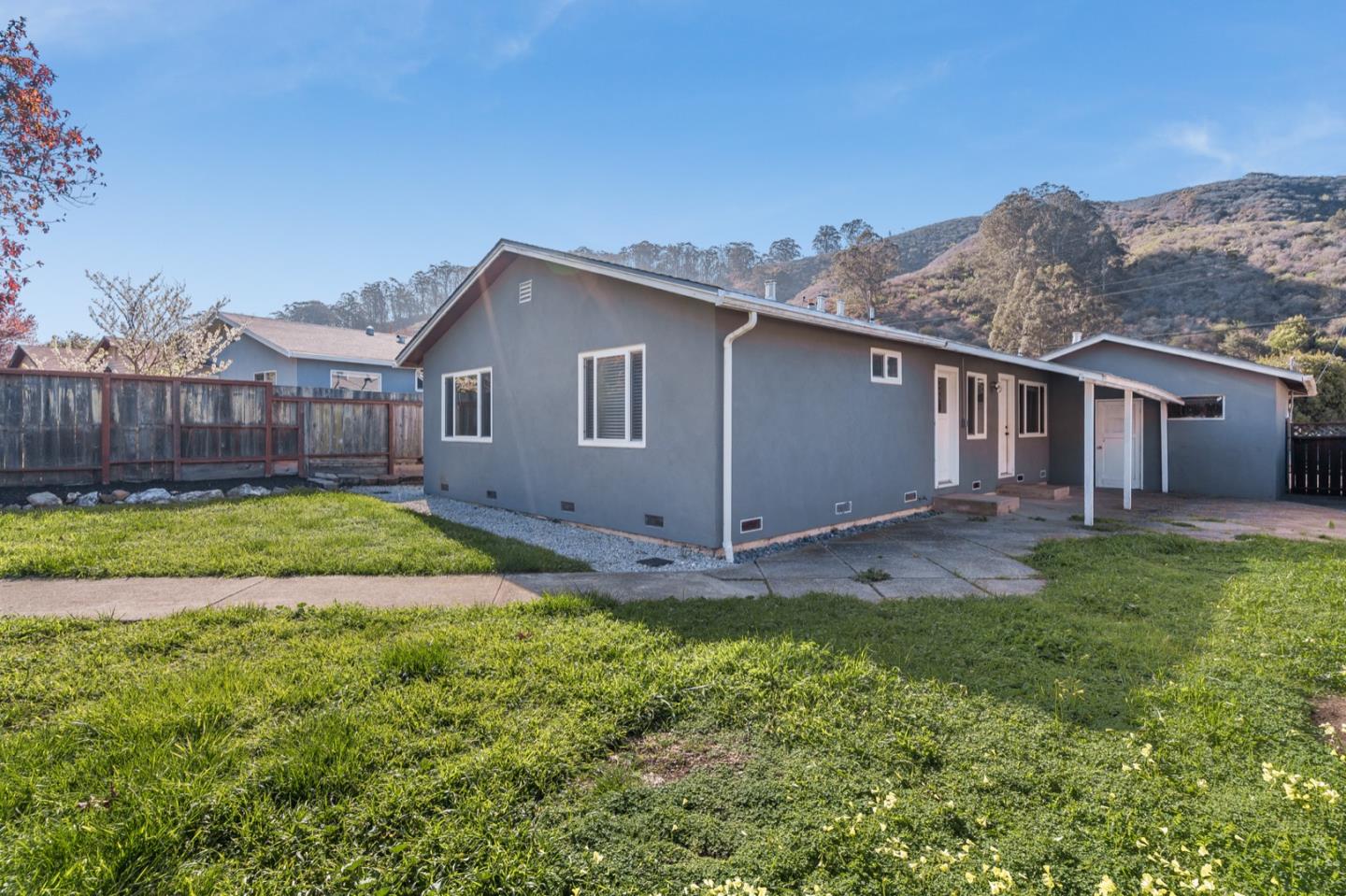 1419 Madeira Drive Pacifica, CA 94044 - Photo 43 of 66 a view of a house with a backyard and a tree