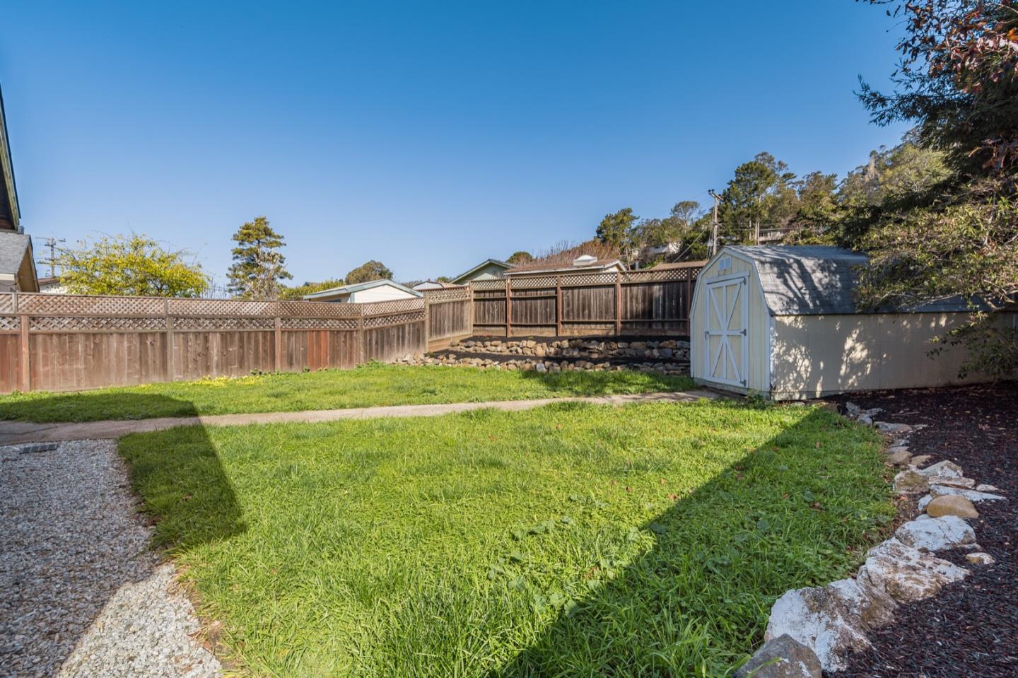 1419 Madeira Drive Pacifica, CA 94044 - Photo 44 of 66 a view of a house with a yard and sitting area