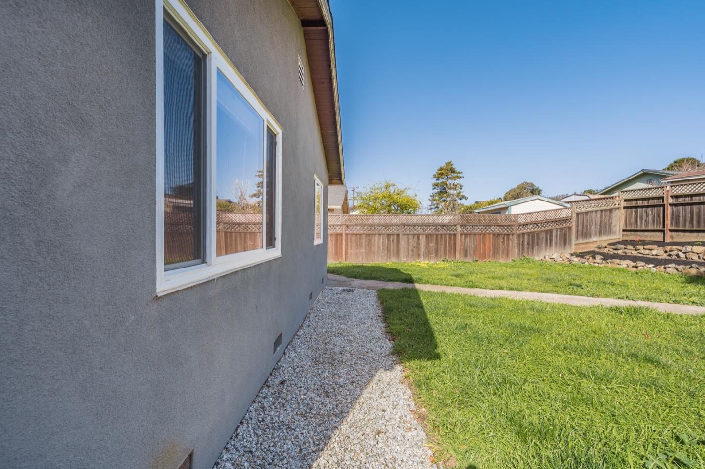 1419 Madeira Drive Pacifica, CA 94044 - Photo 45 of 66 a view of a house with a big yard and large trees