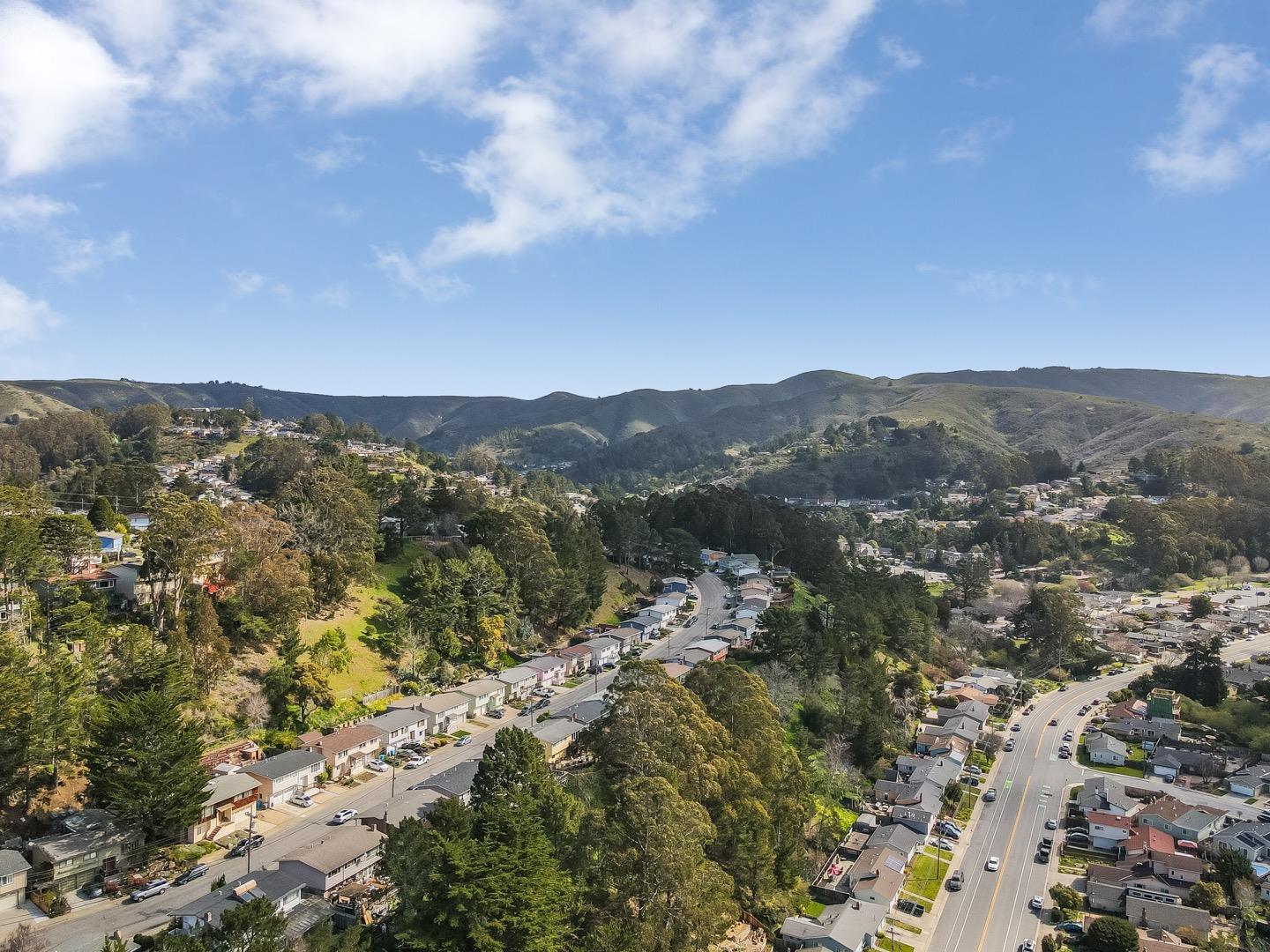 1419 Madeira Drive Pacifica, CA 94044 - Photo 51 of 66 an aerial view of houses covered in trees