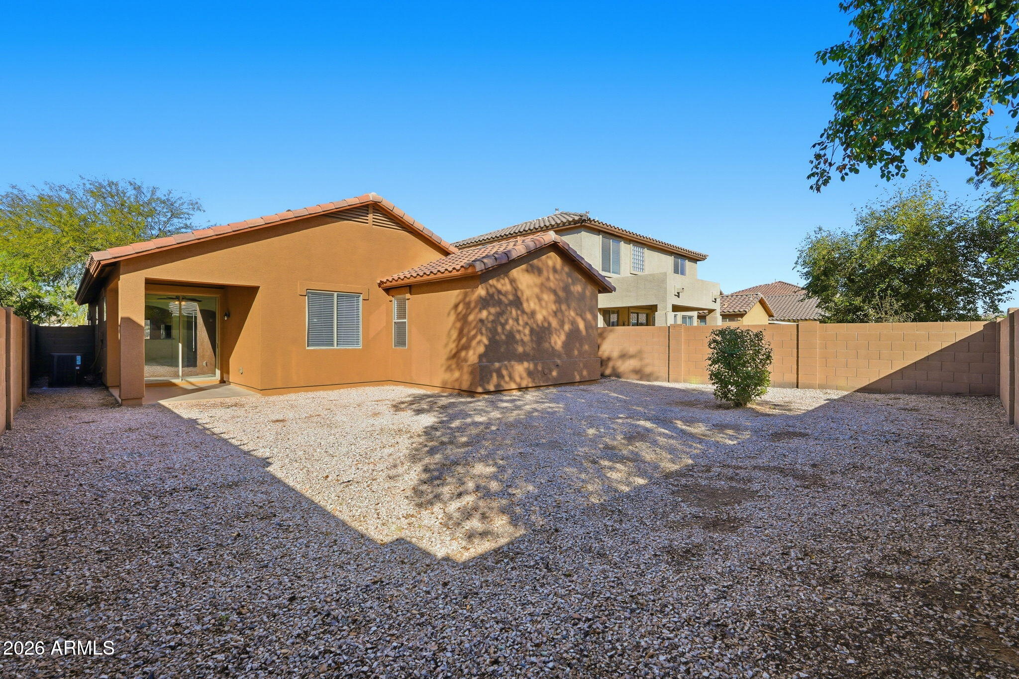 8851 West Payson Road Tolleson, AZ 85353 - Photo 29 of 32 a front view of a house with a yard
