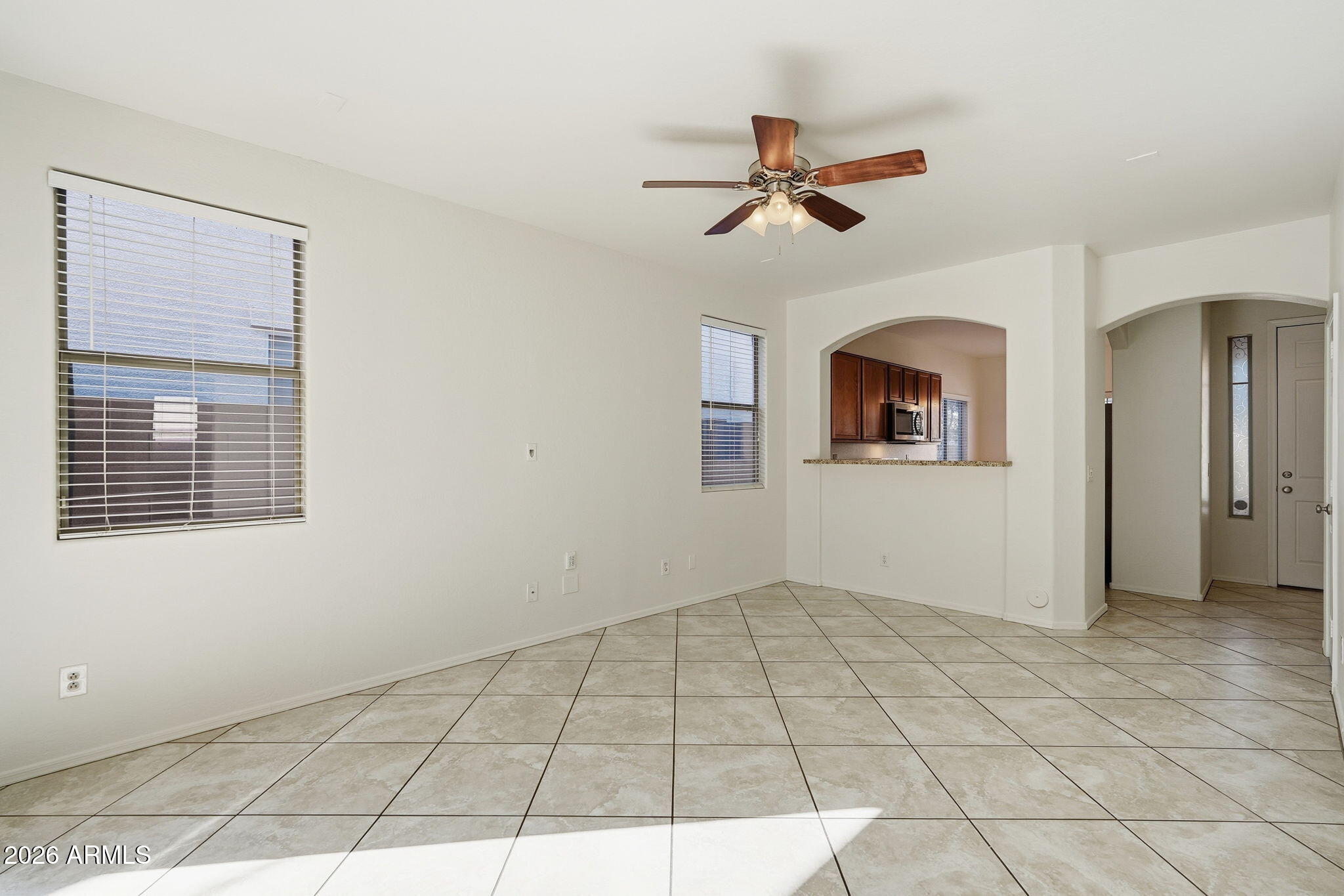 8851 West Payson Road Tolleson, AZ 85353 - Photo 6 of 32 a view of an empty room with a window