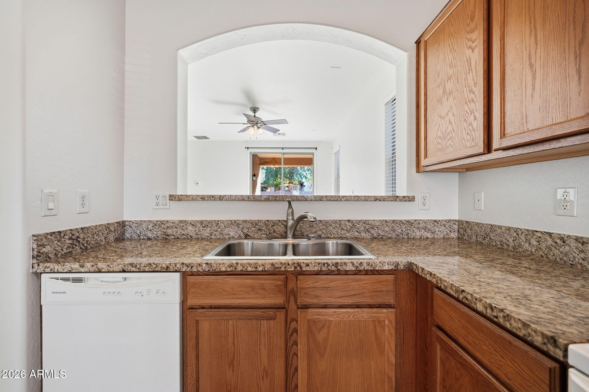 8851 West Payson Road Tolleson, AZ 85353 - Photo 7 of 32 a kitchen with a sink and cabinets