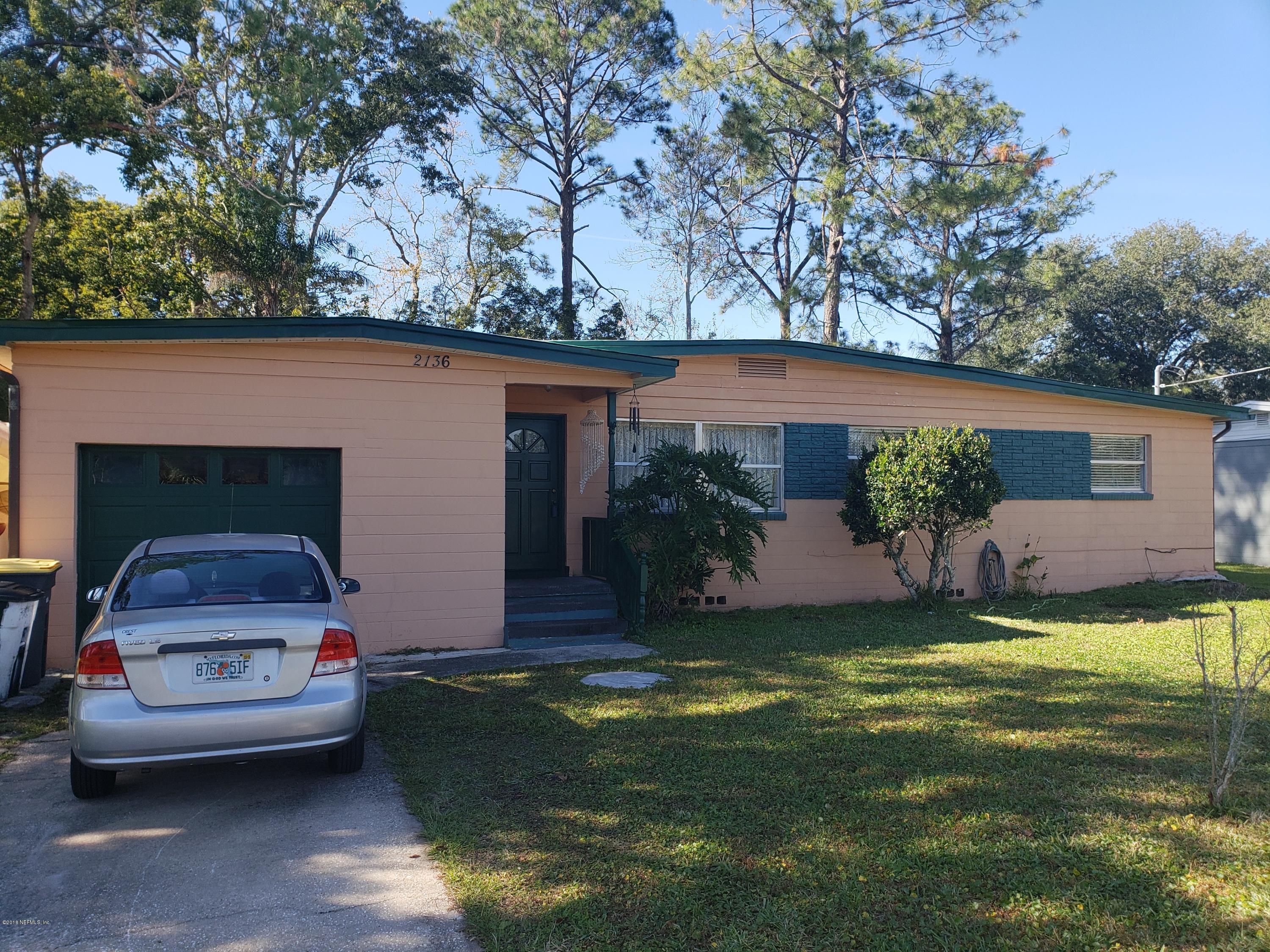 2136 Dean Road Jacksonville, FL 32216 - Photo 2 of 9 a front view of a house with garden