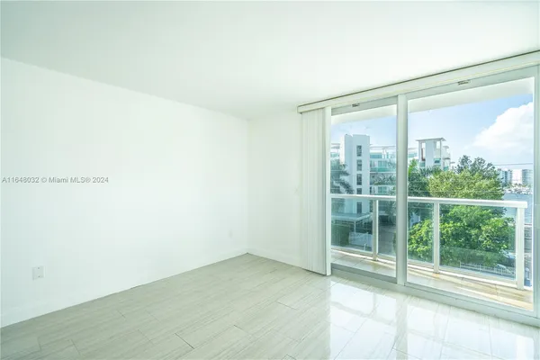 a view of a room with sliding glass door