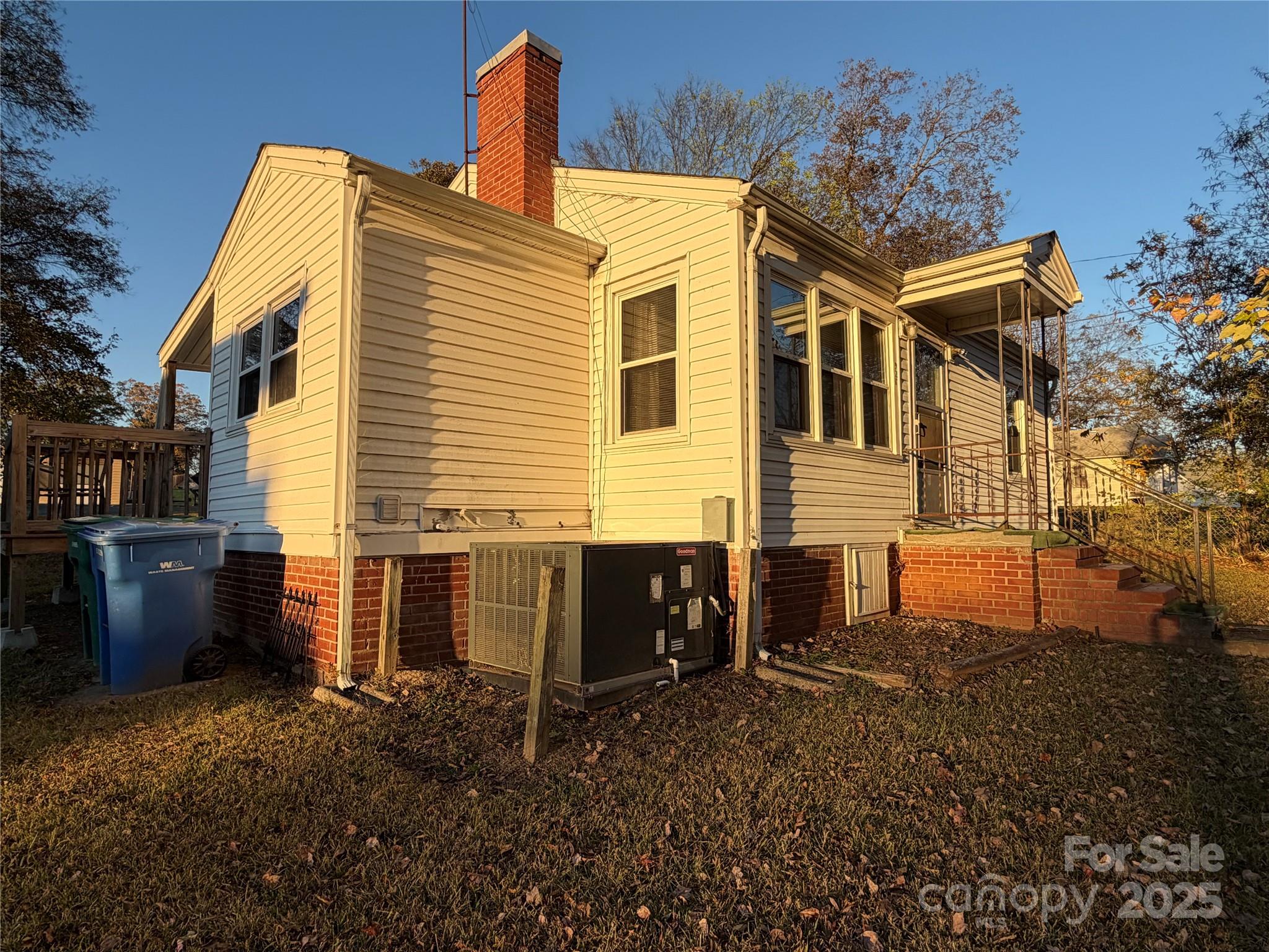 928 Bost Street Albemarle, NC 28001 - Photo 19 of 20 a view of a house with backyard and sitting area