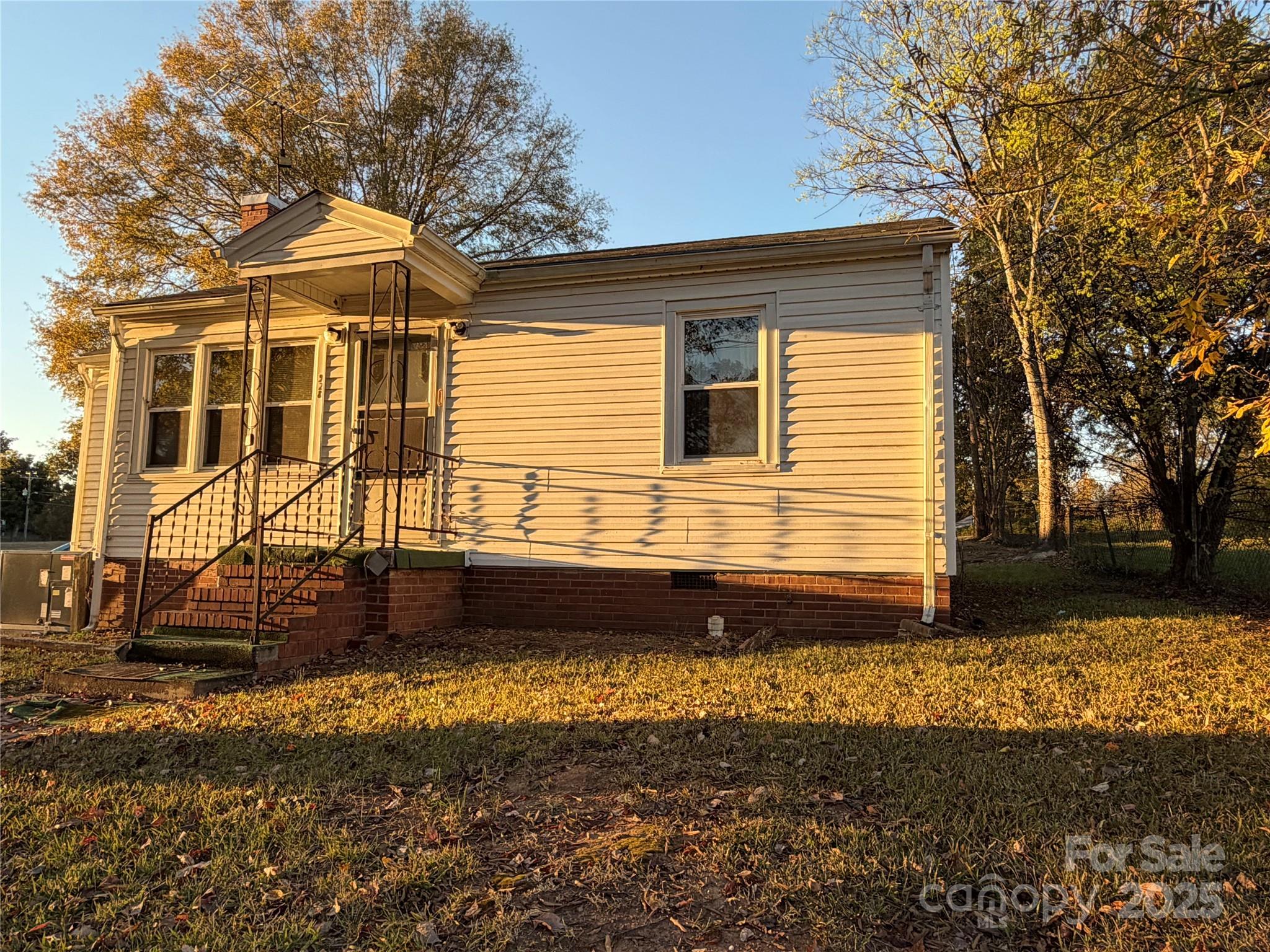928 Bost Street Albemarle, NC 28001 - Photo 2 of 20 a front view of a house with a yard