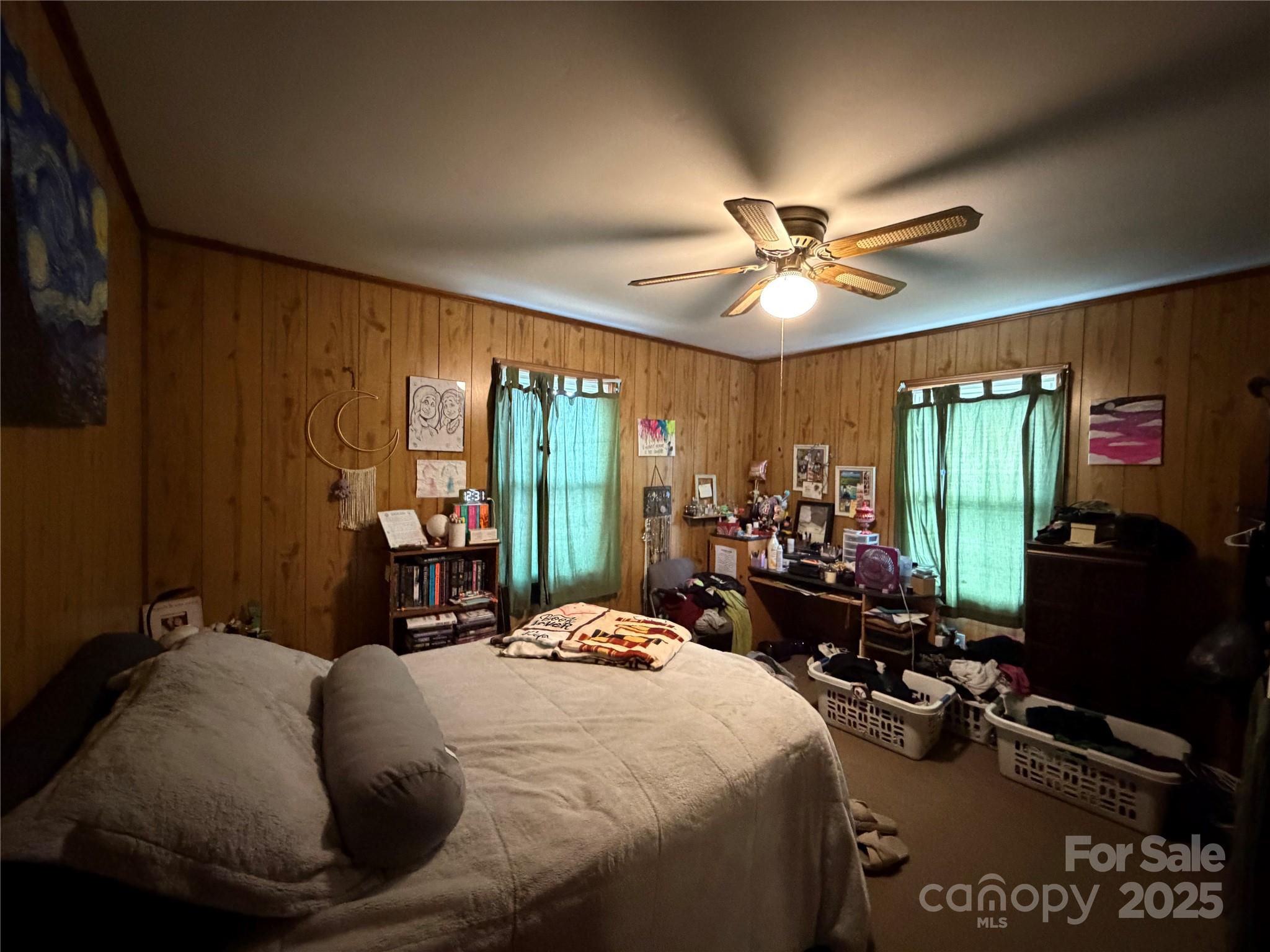 928 Bost Street Albemarle, NC 28001 - Photo 8 of 20 a bed room with a bed and a chandelier