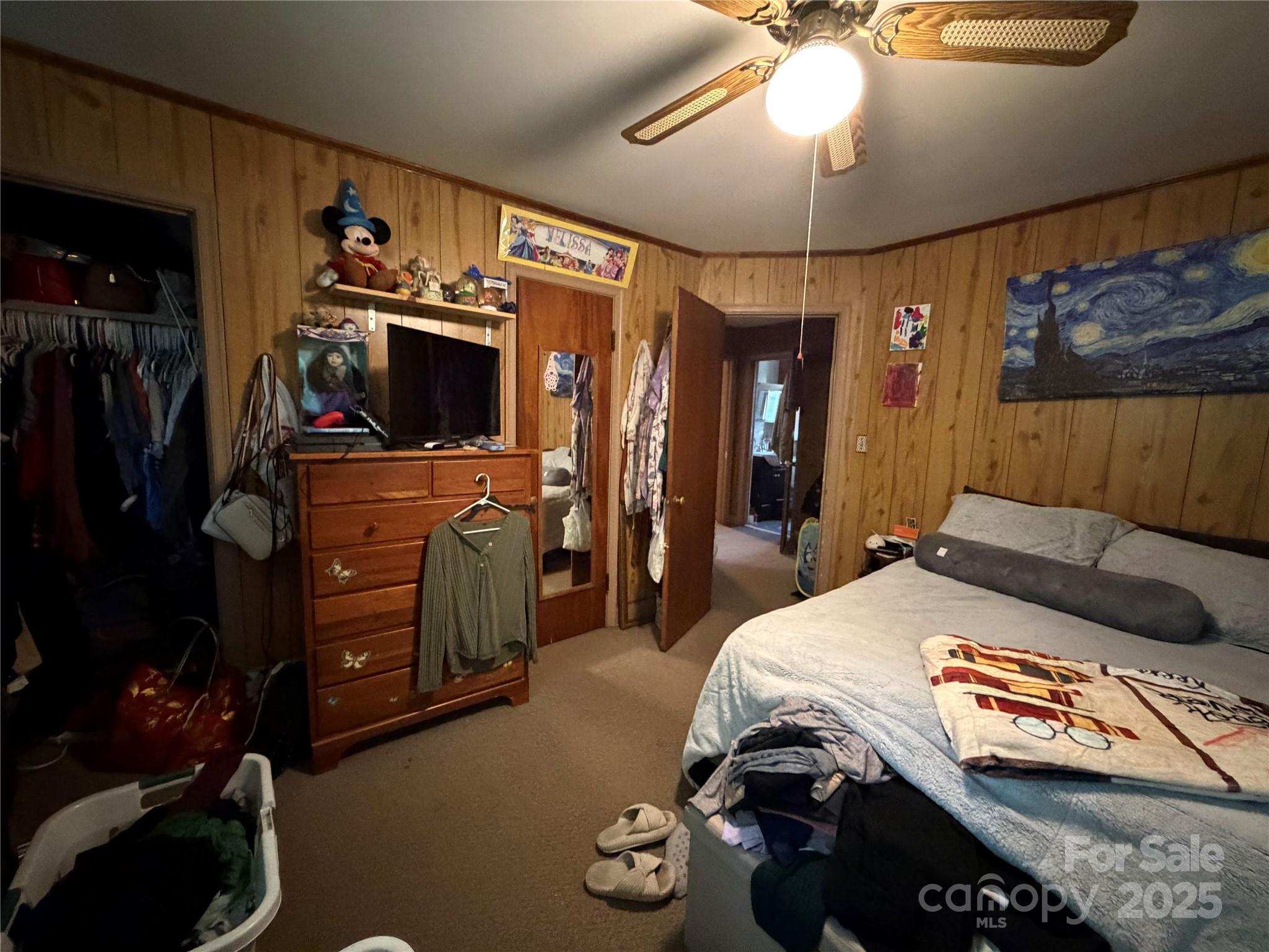 928 Bost Street Albemarle, NC 28001 - Photo 9 of 20 a bedroom with a bed and a mirror