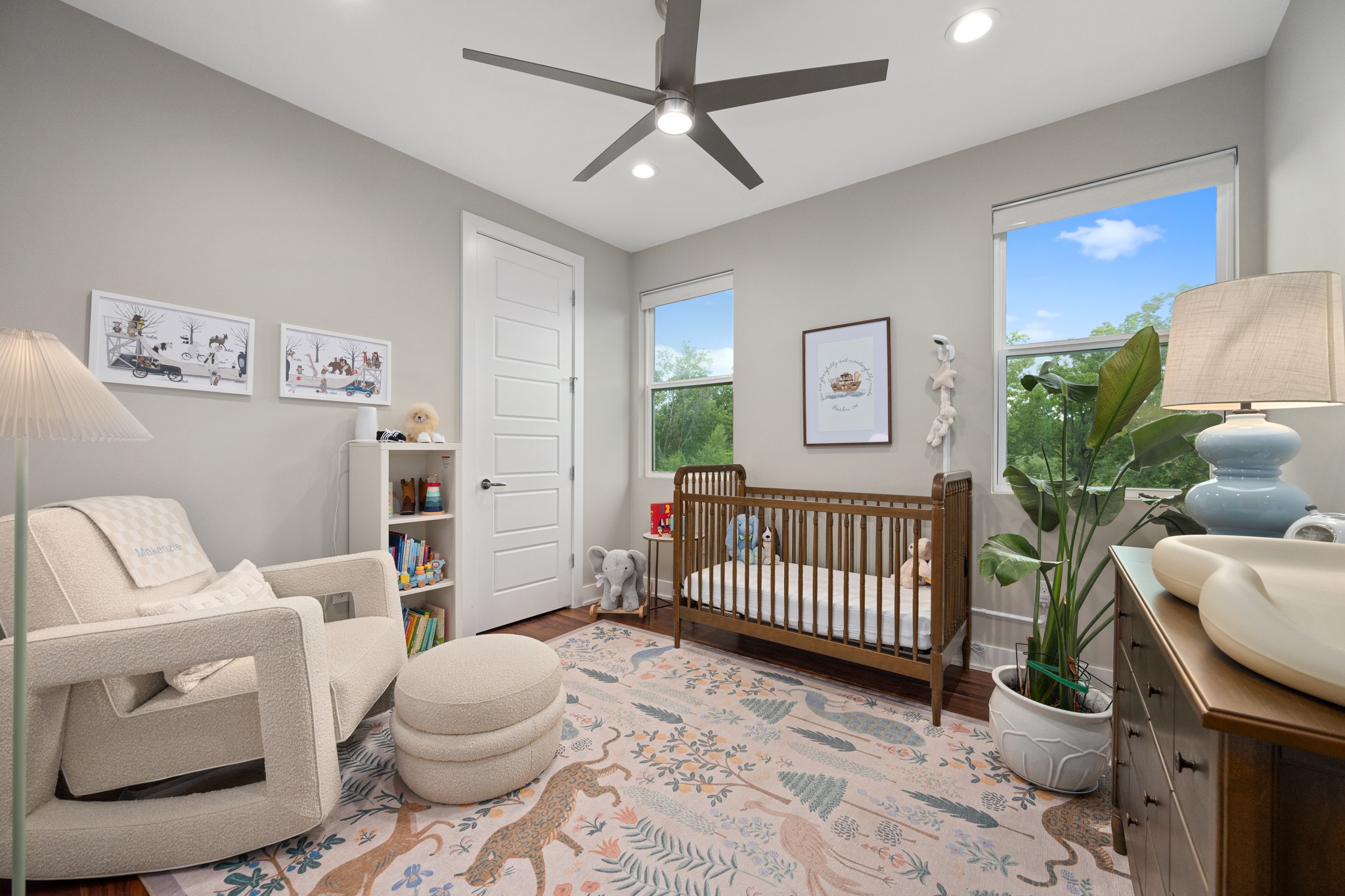 1103 Saucedo Street, Unit 1 Austin, TX 78721 - Photo 37 of 40 A well-lit nursery offers a comfortable glider and a charming area rug.