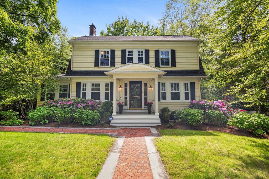 19 Whittier Road Wellesley, MA 02481 - Photo 1 of 23 a front view of a house with swimming pool having outdoor seating