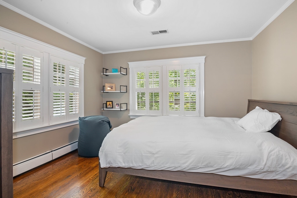 19 Whittier Road Wellesley, MA 02481 - Photo 16 of 23 a bed sitting in a bedroom next to a window