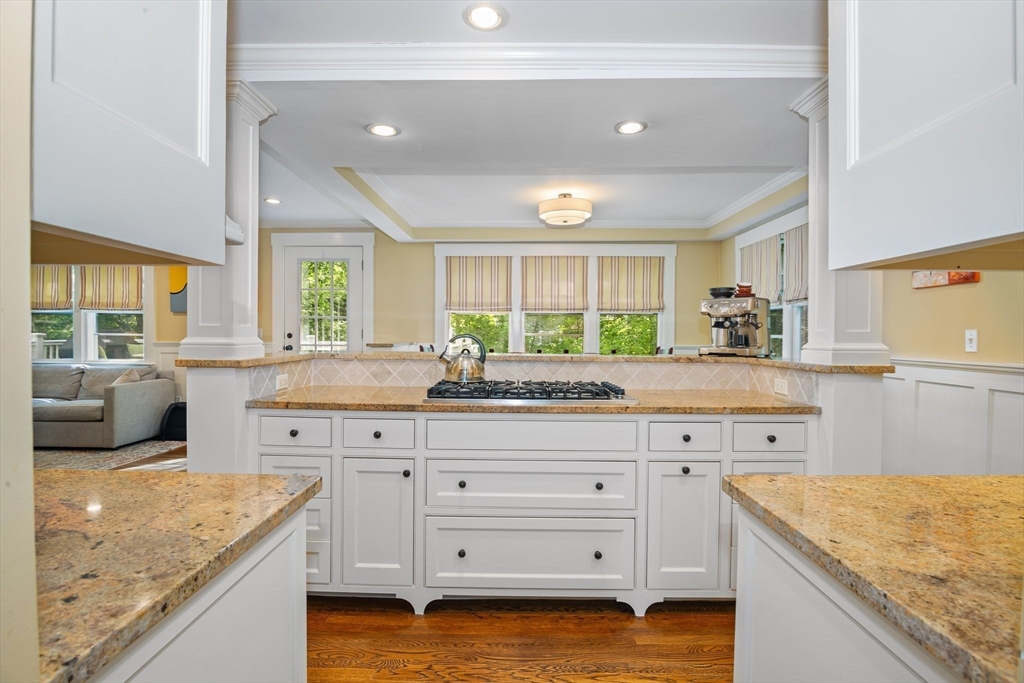 19 Whittier Road Wellesley, MA 02481 - Photo 9 of 23 a kitchen with granite countertop a sink a counter space and wooden floors