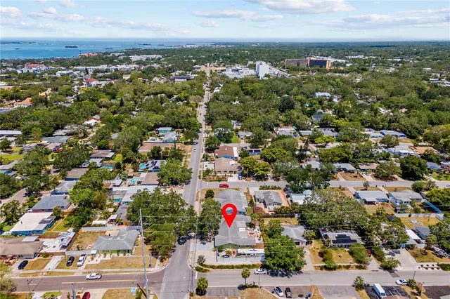 an aerial view of residential houses with outdoor space