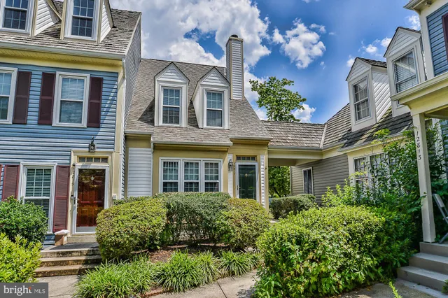 a view of a brick building next to a yard
