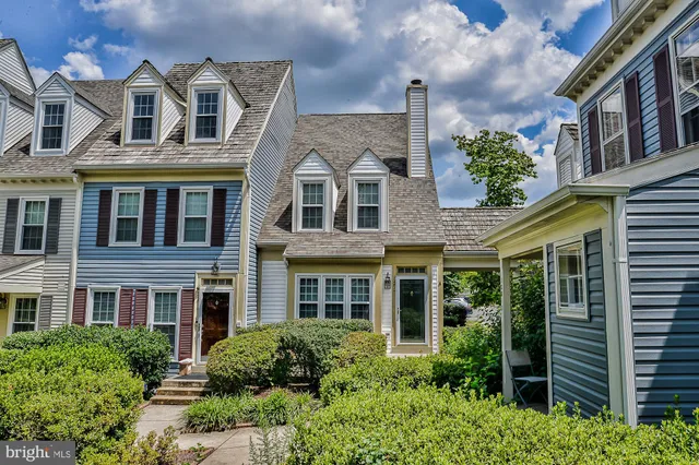 a view of a brick building next to a yard