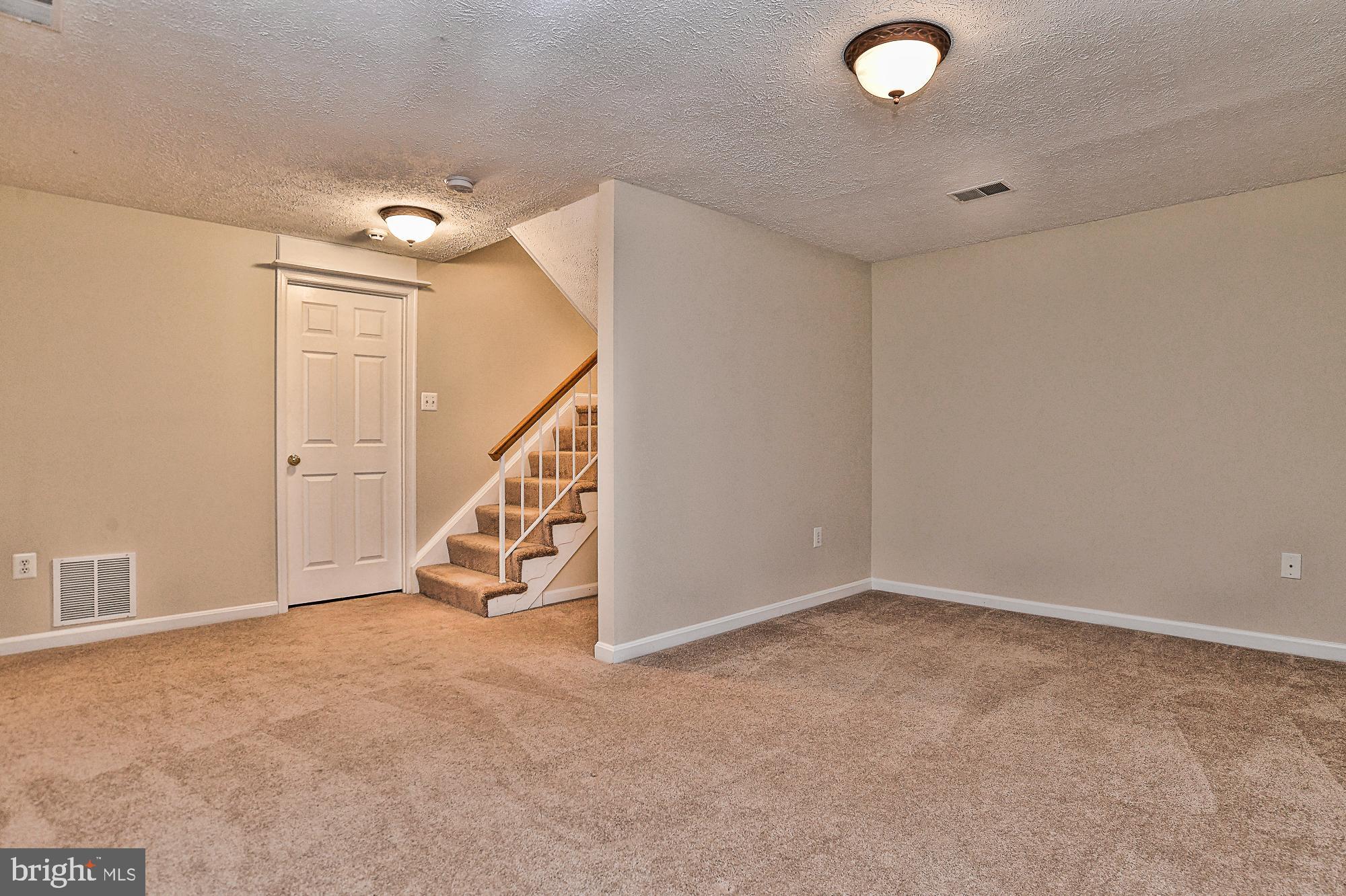12817 Mill Brook Court Woodbridge, VA 22192 - Photo 28 of 34 a view of an empty room with stairs