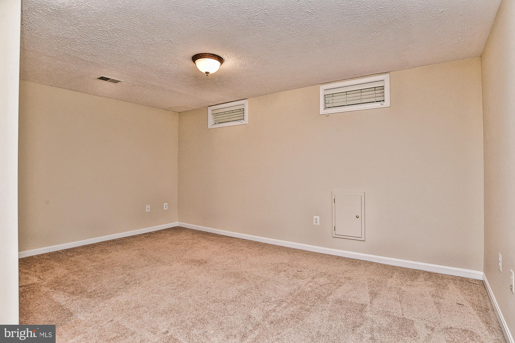 12817 Mill Brook Court Woodbridge, VA 22192 - Photo 29 of 34 an empty room with an entryway
