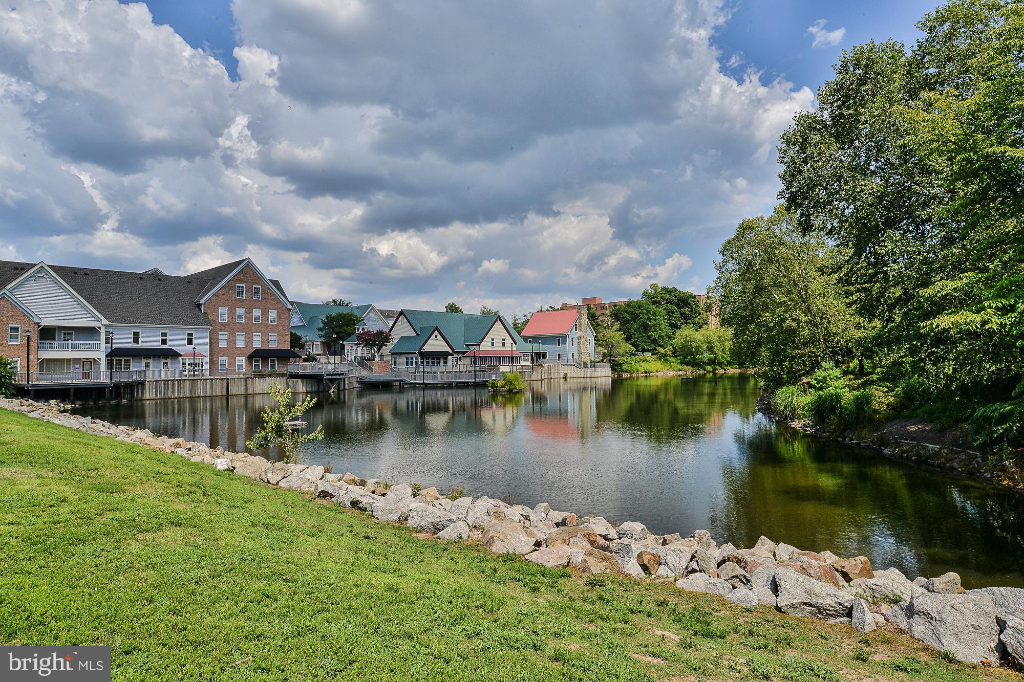 12817 Mill Brook Court Woodbridge, VA 22192 - Photo 31 of 34 a view of a lake with houses in big yard