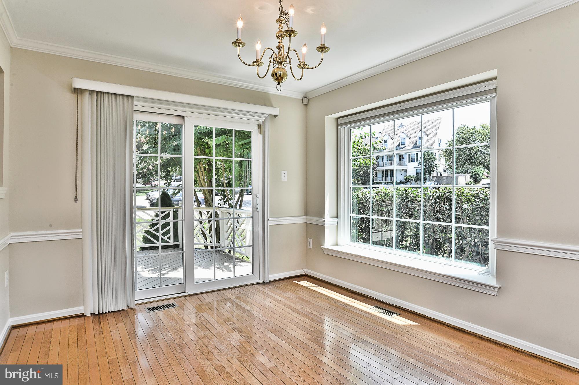 12817 Mill Brook Court Woodbridge, VA 22192 - Photo 10 of 34 a view of an empty room with wooden floor and a window