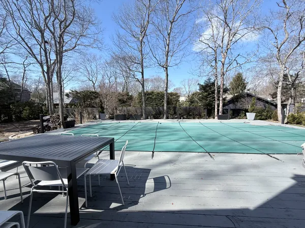 a view of a table and chairs on roof deck