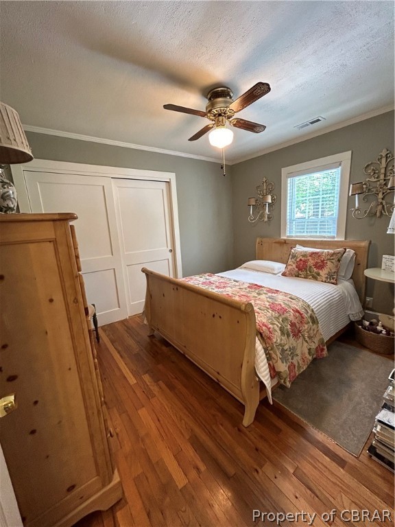 1438 Lafayette Road Gloucester Point, VA 23062 - Photo 18 of 34 Bedroom with crown molding, wood-type flooring, ceiling fan, and a textured ceiling