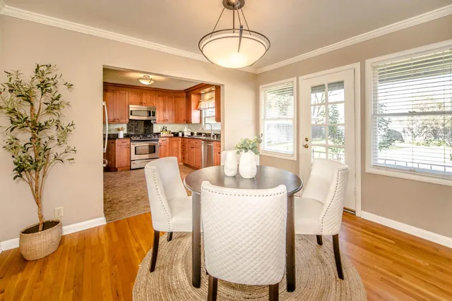 a kitchen with granite countertop a sink stove and cabinets