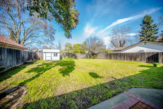 a front view of house with yard and seating area