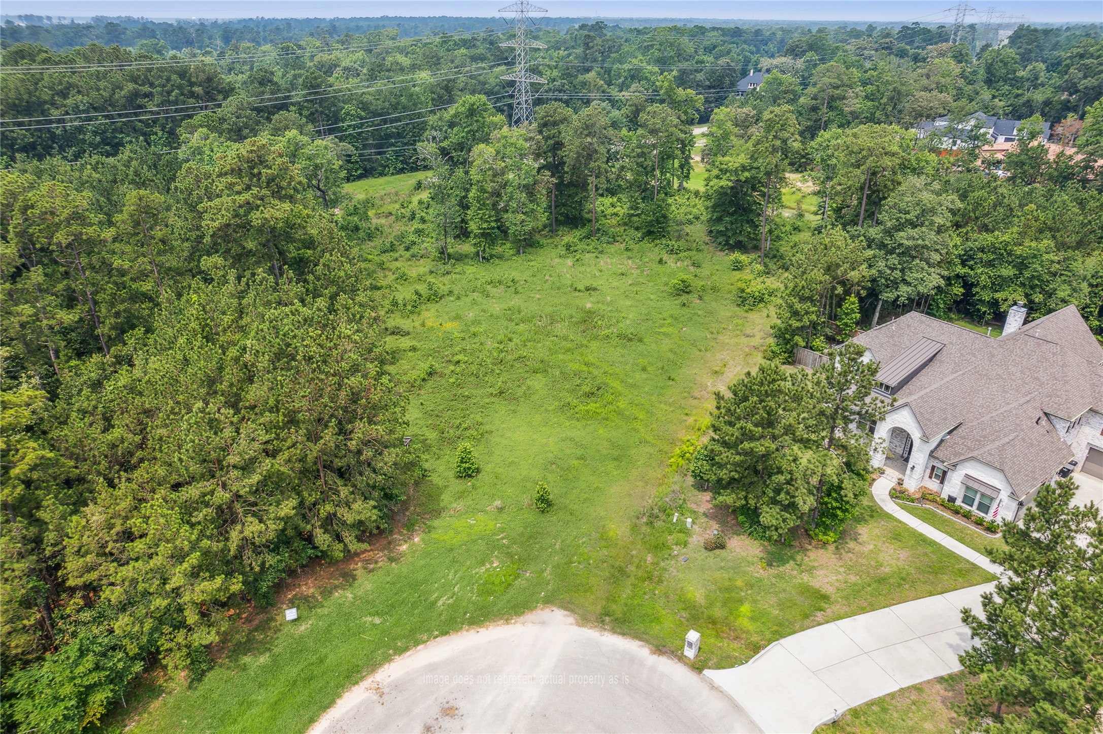 4406 Chateau Creek Way Spring, TX 77386 - Photo 2 of 14 an aerial view of a house with a yard