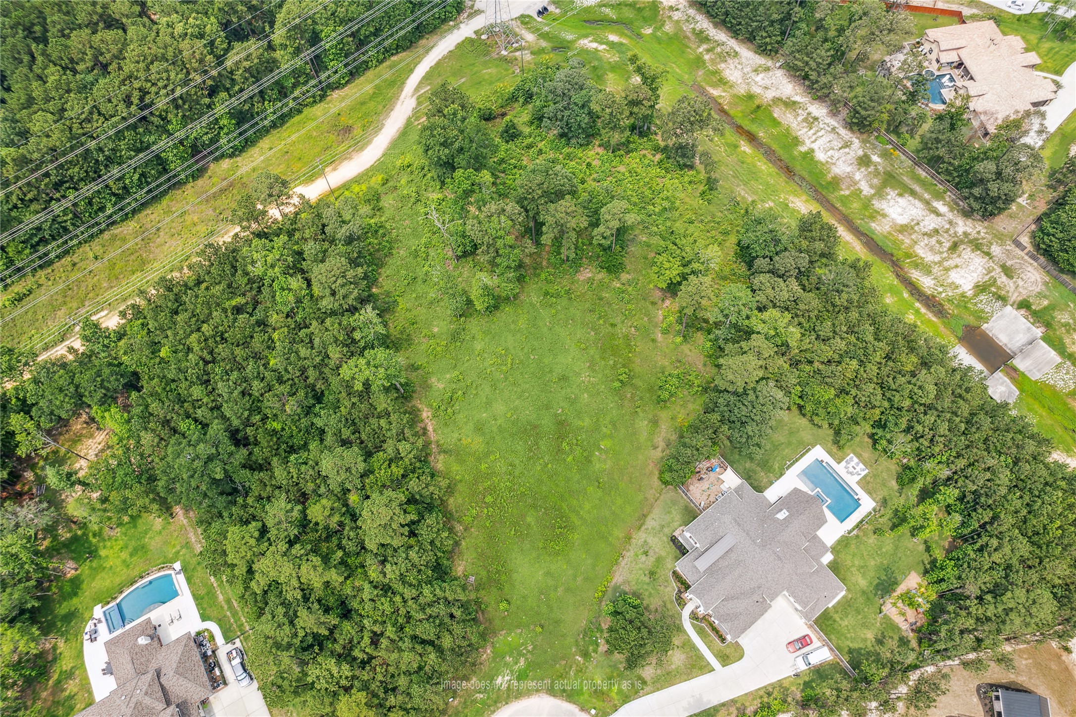 4406 Chateau Creek Way Spring, TX 77386 - Photo 5 of 14 an aerial view of residential houses with outdoor space and trees