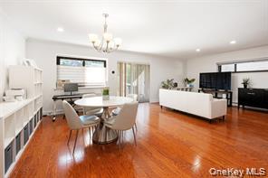 21 Canterbury Road, Unit 6 Great Neck, NY 11021 - Photo 12 of 32 a view of a dining room with furniture and wooden floor