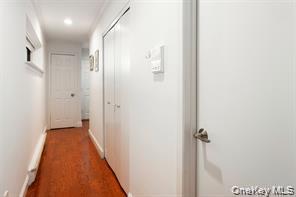 21 Canterbury Road, Unit 6 Great Neck, NY 11021 - Photo 17 of 32 a view of a hallway with a white walls