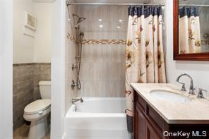 21 Canterbury Road, Unit 6 Great Neck, NY 11021 - Photo 20 of 32 a bathroom with a sink toilet and shower