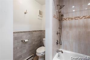 21 Canterbury Road, Unit 6 Great Neck, NY 11021 - Photo 22 of 32 a bathroom with a shower and a toilet