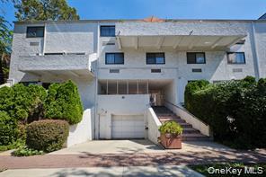 21 Canterbury Road, Unit 6 Great Neck, NY 11021 - Photo 30 of 32 front view of a house with potted plants