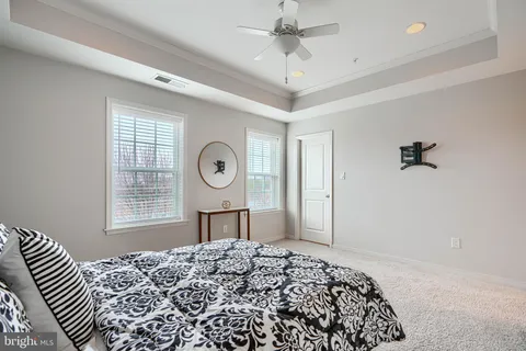 a bedroom with bed and a window