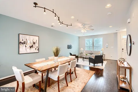 a view of a dining room with furniture and a rug