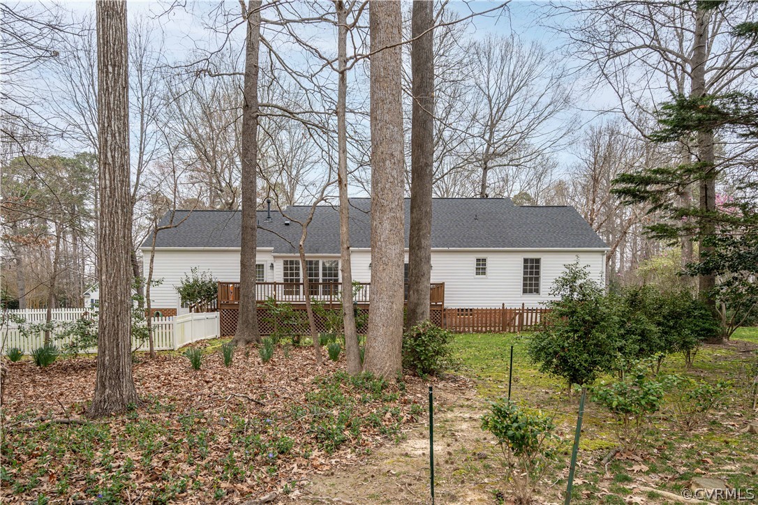 121 Broadmoor Williamsburg, VA 23188 - Photo 3 of 34 a view of a brick house next to a yard with large trees