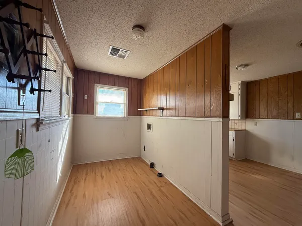 a kitchen with granite countertop wooden cabinets and a stainless steel appliances