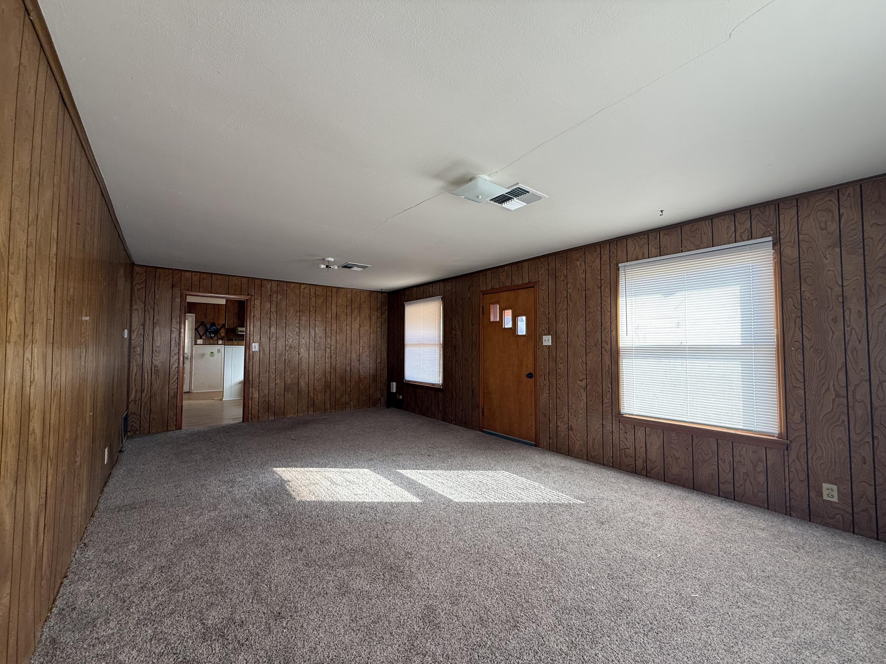 715 West Davis Street Memphis, TX 79245 - Photo 7 of 11 an empty room with windows and closet