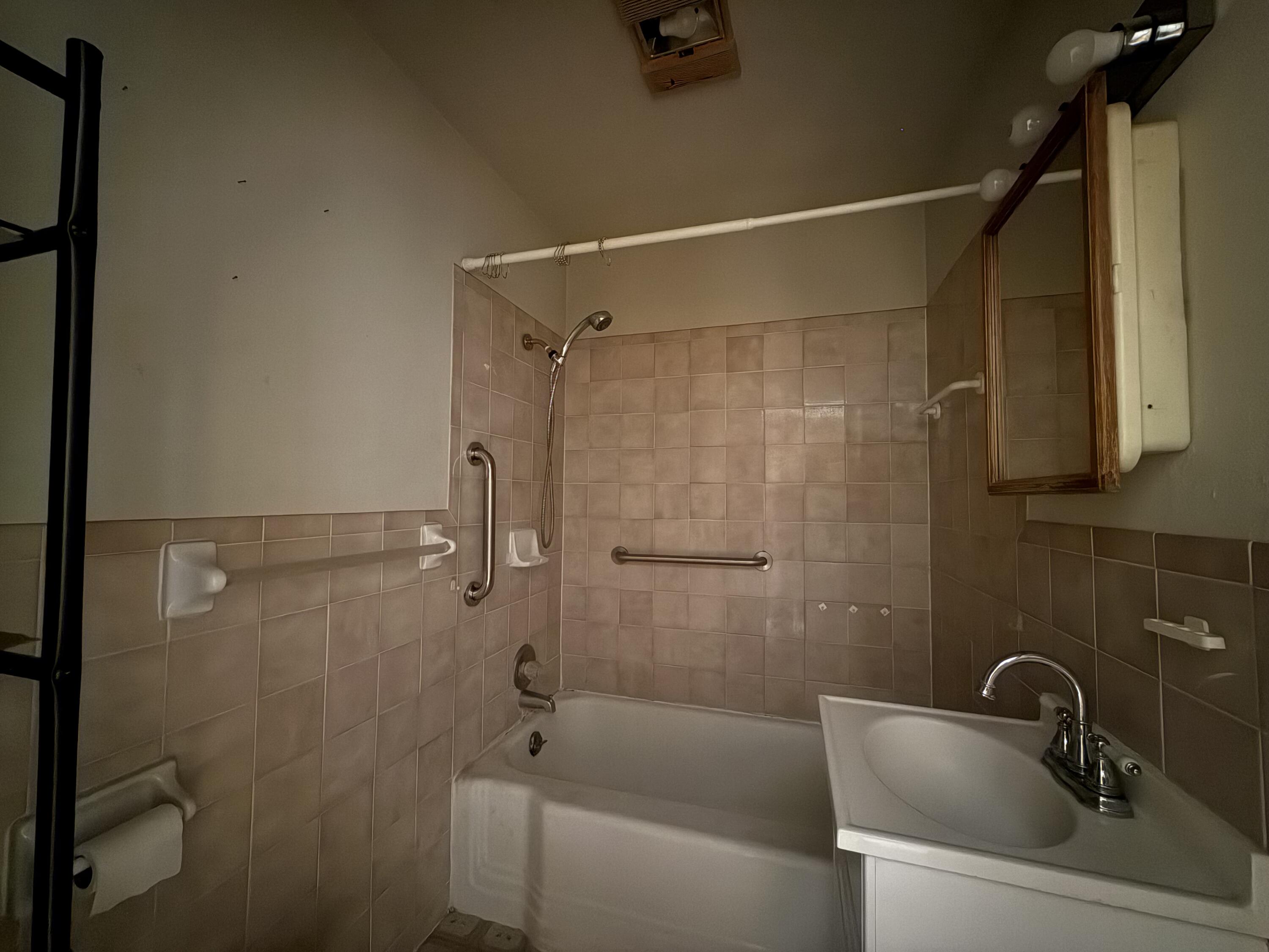 715 West Davis Street Memphis, TX 79245 - Photo 10 of 11 a bathroom with a sink and shower