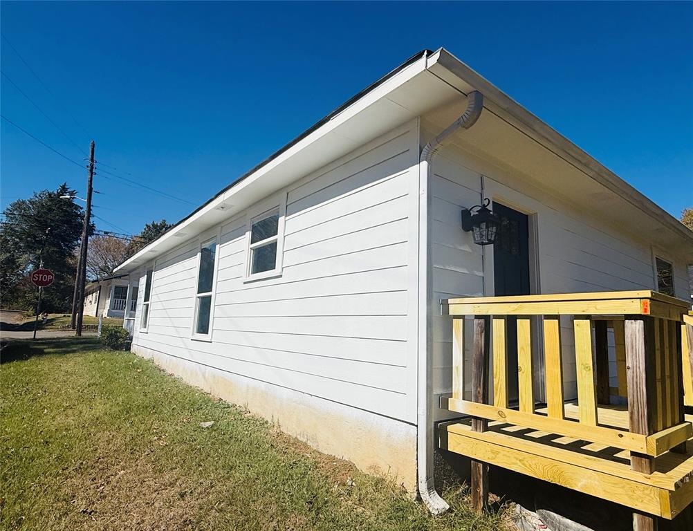 255 7th Street Southwest Paris, TX 75460 - Photo 5 of 17 a view of a balcony with wooden floor and outdoor space