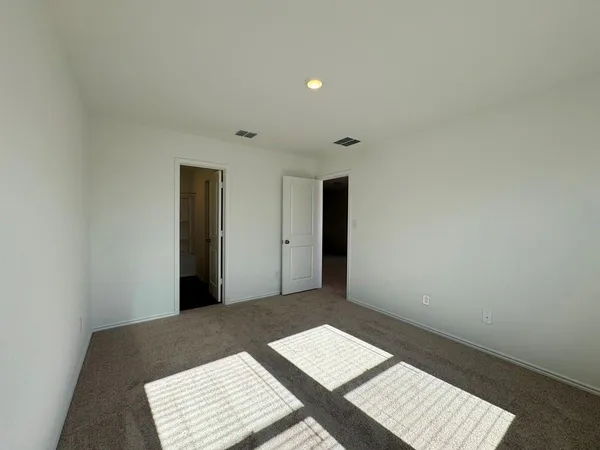 a view of an empty room and window