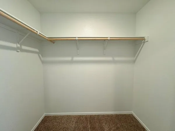 a bathroom with a toilet a sink a tub and mirror