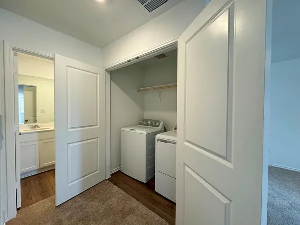 a bathroom with a shower and a sink
